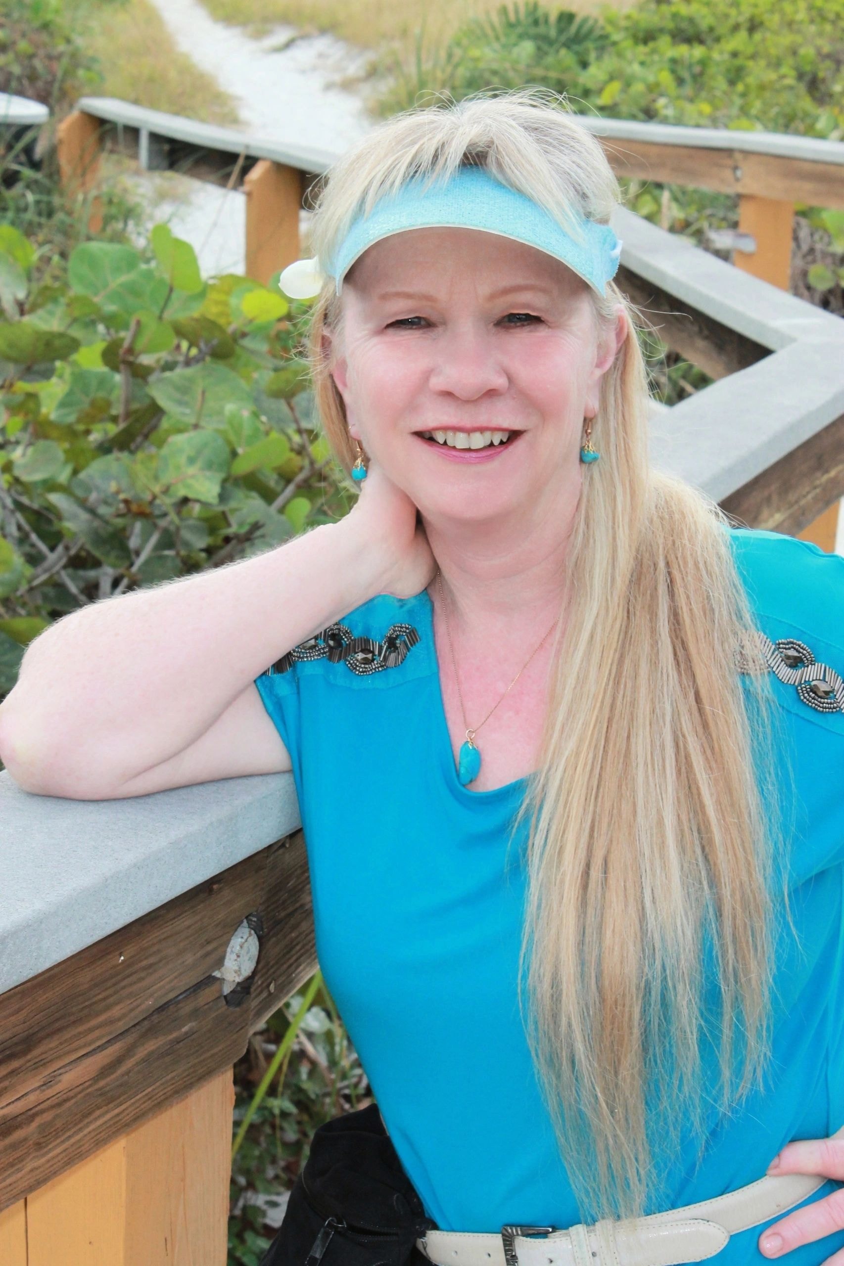 Vicki Reeve smiling at a garden raised bed